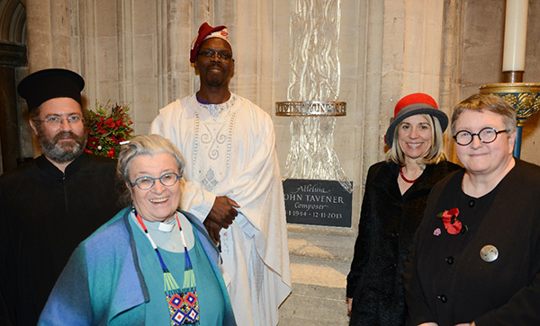 The Rev Andreas Andreopoulos, Dr Olu Taiwo, Professor Joy Carter, the University Vice-Chancellor, Professor Elizabeth Stuart, the Deputy Vice-Chancellor and the Rev Professor June Boyce-Tillman, Director of the Tavener Centre, in front of the memorial statue to Sir John Tavener